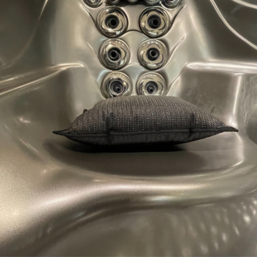 CAPO Weighted Hot Tub Cushion, black seat booster positioned in a jet tub, designed to prevent floating and enhance comfort.