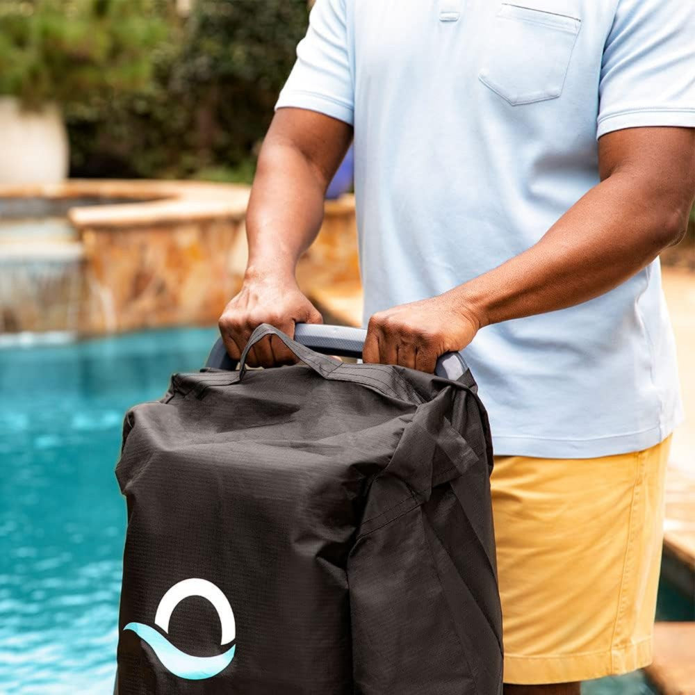 Person holding the Maytronics Dolphin Universal Caddy by the pool, showcasing its storage and transport features.